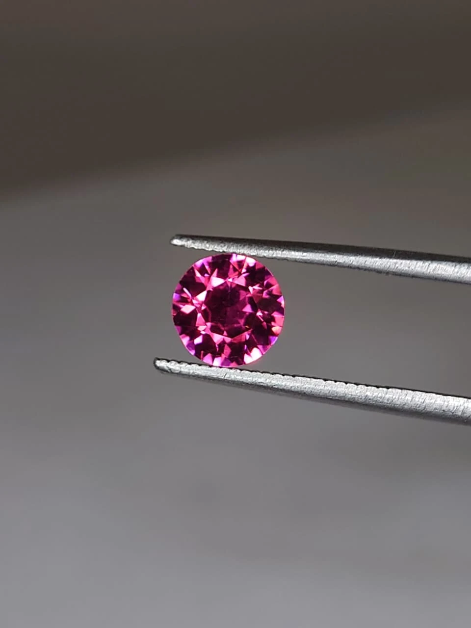 1.3ct Round Brilliant Faceted Malaya Garnet from Tanzania — view 5